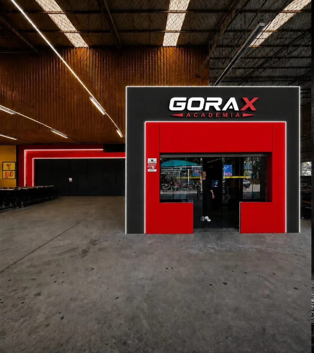 Fachada da Gorax Academia com detalhes vermelhos (render)